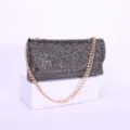 Close-up view of a sparkling rhinestone evening clutch bag with elegant gold chain strap detail. - Dark Gray
