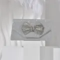 Sparkling silver rhinestone bow evening bag detail, luxurious glitter clutch for women. - Silver