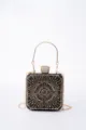 Detail shot of the sparkling rhinestone evening clutch, highlighting intricate geometric metal design. - Black
