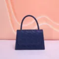 Exquisite lace handbag detail, dark blue structured evening bag with top handle and flap close. - Dark Blue