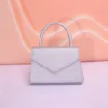 Silver mini top handle handbag, chic leather evening clutch bag with elegant design. - Silver
