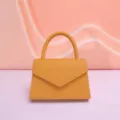 Stylish women's yellow leather top handle handbag, elegant envelope evening bag for daily wear. - Orange