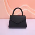 Elegant black leather top handle evening handbag, chic envelope flap design for daily and party use. - Black