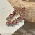 Close-up of pink crystal star hair clip detail, sparkling rhinestone duckbill clip accessory. - Five-Point Star Pink