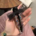 Pince à cheveux nœud strass, élégante pince bec de canard noire variante cristaux colorés. - Arc-en-ciel