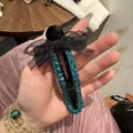 Molla per capelli con fiocco in strass nero e cristalli blu, elegante becco d'anatra. - Blu
