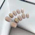 Nude press-on nails with cat eye shimmer and crystal stone accents, medium length. - Style 080 Press On Nails
