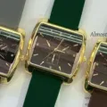 Close-up detail of Koutake square gold-tone quartz watch with colorful silicone strap. - Gold Case Black Dial Green Strap