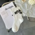 Japanese sweet JK white mid-calf socks with black bow and delicate lace, cute Lolita style. - One Size / White Ruffle Cable Bow