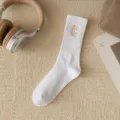 White mid-tube socks for women, featuring a chic embroidered letter C design. Soft cotton, comfortable fit. - White