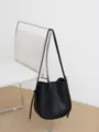 Black leather bucket bag, minimalist single-shoulder crossbody bag for women daily commute. - Black
