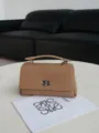 Elegant tan leather top handle handbag with metal turn lock closure for women daily fashion use. - Apricot