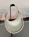 White leather crescent shoulder bag with stylish braided strap and gold hardware for women. - Off White