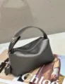Dark grey genuine leather pillow handbag, soft top handle fashion bag with metal clasp. - 22x9x11cm / Pearl Grey