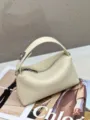 Top layer cowhide pillow bag fashion niche lunchbox handbag minimalist leather shoulder bag - 22x9x11cm / Milk White
