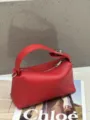 Red genuine leather handbag for women, stylish soft pillow crossbody bag, chic top handle lunch box bag. - 22x9x11cm / Red