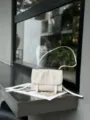 Detail view of premium first-layer cowhide messenger bag, casual stylish commuter shoulder bag. - 23*7*17cm / Off White