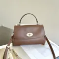 Vintage brown leather crossbody bag with metal turn-lock closure and elegant top handle. - 24*10*15CM / Coffee