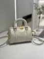 White glossy leather Boston handbag, vintage retro shoulder cross-body bag with gold hardware. - White