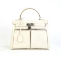 White leather top handle handbag with turn lock closure and dual front zippered pockets - 28*12*22CM / Milk White