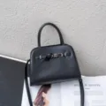Black genuine leather women handbag, stylish commuting shoulder bag with buckle design. - 24 * 10 * 18CM / Black