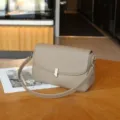 Genuine leather crossbody shoulder bag for women, stylish flap design with metal lock closure. - Gray