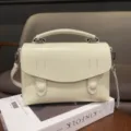 Elegant leather top handle bag for women, vintage crossbody shoulder bag with flap design. - Off White