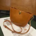 Elegant brown leather saddle bag for women, stylish crossbody and shoulder purse daily. - Sunset Yellow