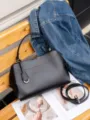 Black leather shoulder bag with top handle and detachable strap, elegant style for daily use. - Small Size 24x10x19cm / Black
