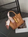 Stylish brown leather handbag for women with elegant metal lock and chic printed twilly scarf. - 27*10*17cm / Biscuit Color