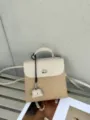 Two-tone leather women backpack with mini bag charm, stylish travel daypack, beige and tan. - 25x11x24cm / Apricot White