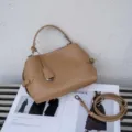 Detailed view of stylish camel leather handbag with top handle and strap on fashion magazine. - Small Size 24x10x19cm / Milk Apricot