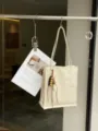 Minimalist beige genuine leather tote bag for women, spacious shoulder bag with wooden bead charm. - 26*28*9cm / Off White
