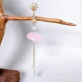 Detailed close-up of Chinese traditional style ruyi tassel cheongsam brooch accessory. - Pink Fan