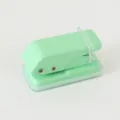 Light green mini metal hole puncher for student stationery and loose leaf paper binding. - Macaron Green
