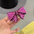 Pince à cheveux nœud strass rose, barrette à ressort en cristal brillant pour coiffure élégante. - Rose rouge
