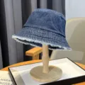 Washed denim bucket hat for women, vintage frayed edge sunshade cap for outdoor casual wear. - Fringed Style / Dark Blue