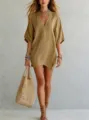 Casual V-neck solid color resort top detail, showing relaxed fit and elegant styling. - Camel