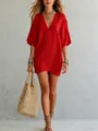Red v-neck loose tunic dress vacation style paired with woven straw bag detail showcase view - S / Tops / Red