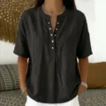 Close-up detail of casual V-neck button-front short sleeve blouse, comfortable relaxed fit. - S / Tops / Black