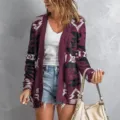 Close-up detail of women's long sleeve tribal geometric print cardigan sweater in burgundy. - Purple