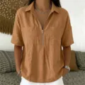 Detail view of the casual short sleeve shirt featuring front zipper and lapel collar design. - S / Tops / Khaki