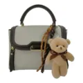 Retro women's top handle handbag with cute bear plush pendant and chic braided rope charms. - White With Pendant