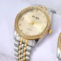 Klassische zweifarbige Quarzuhr aus Stahl mit Strasslünette und goldenem Zifferblatt. - Bicolor Goldzifferblatt