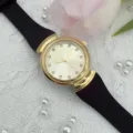 Vintage women's quartz watch with gold case, black silicone strap and crystal dial. - Gold Dial Black Strap - Women