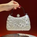 Silver beaded evening clutch bag with metal handle and pearl clasp for elegant party wear. - Silver