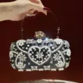 Black beaded evening clutch bag with pearl and rhinestone heart design for elegant party wear. - Black