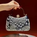 Black beaded evening clutch bag with pearl embellishment and gold handle for women variant. - Black