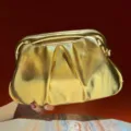 Shiny gold pleated clutch bag for women, elegant evening party handbag with metallic frame. - Gold
