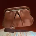 Brown pleated clutch bag, stylish glossy pouch handbag for evening party and casual wear. - Tan